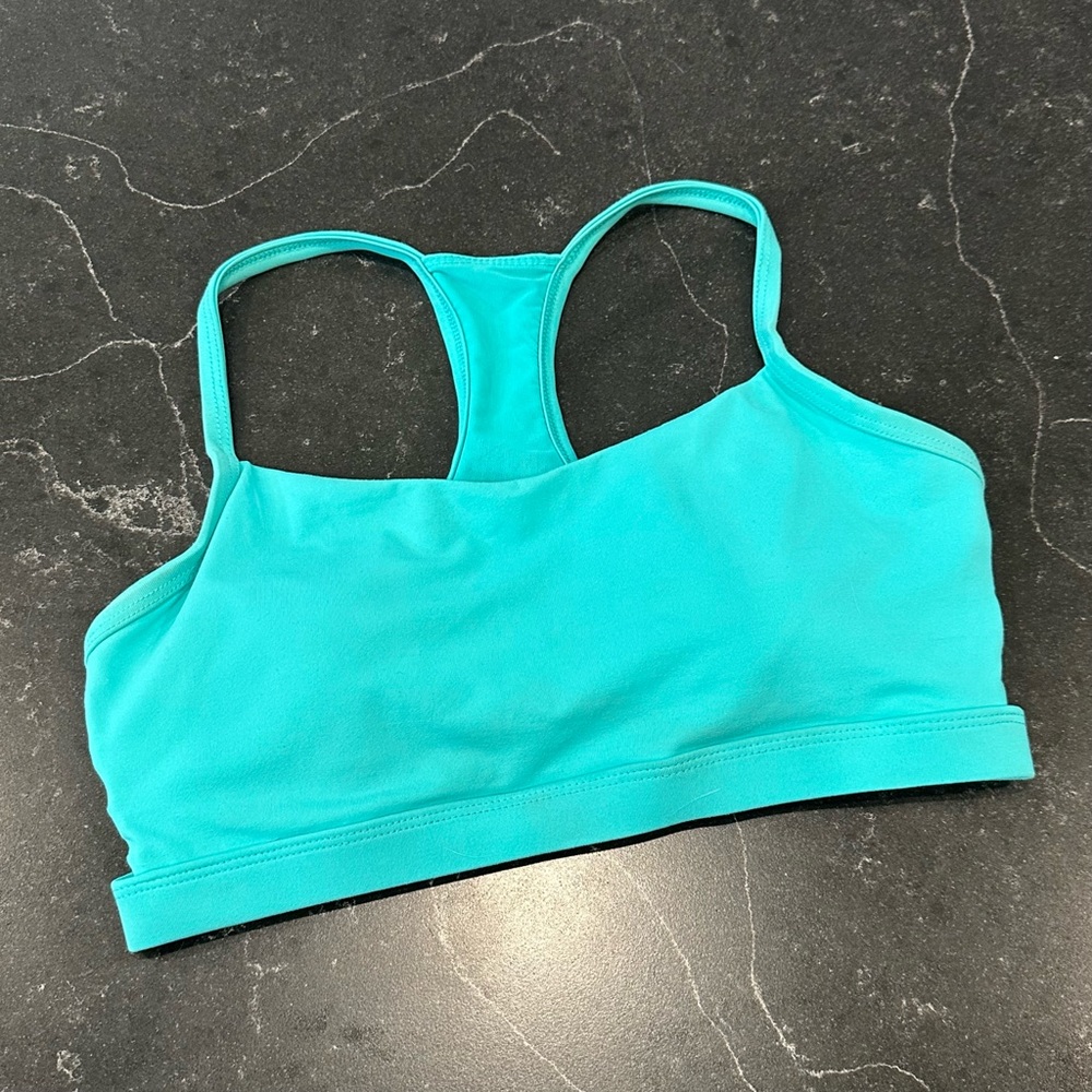 light blue/teal Fabletics sports bra